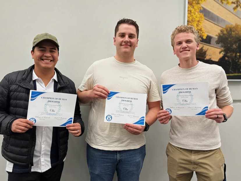 My team and I holding our first place award at I-Hack 2025